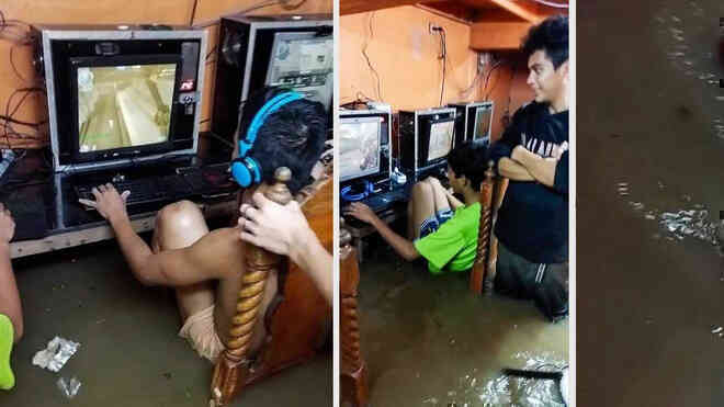 Game thủ nhí phớt lờ nguy cơ bị điện giật, chìm đắm trong game khi quán net ngập nước lũ