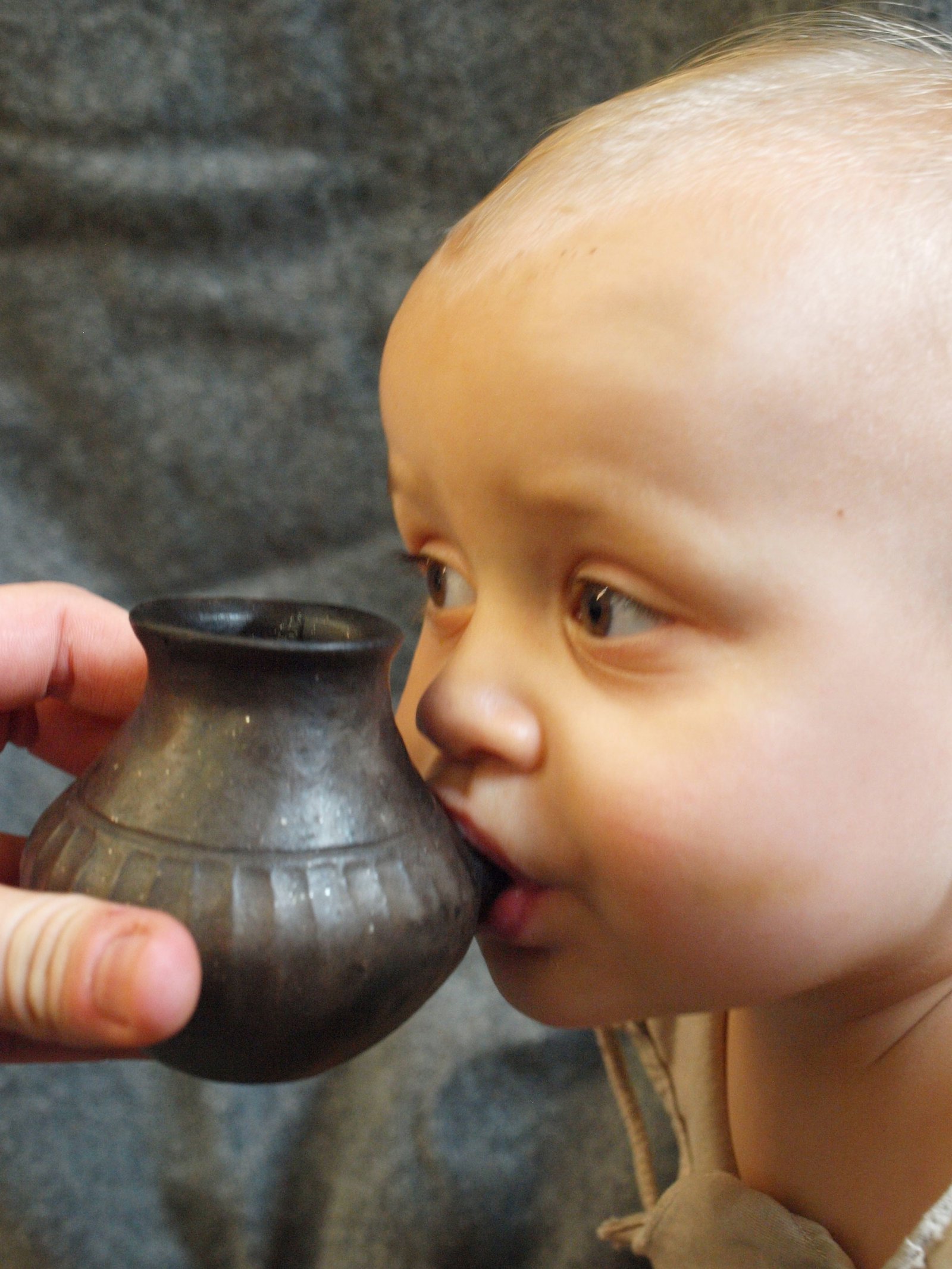 modern-day-baby-feeding-from-reconstructed-vessel.jpg